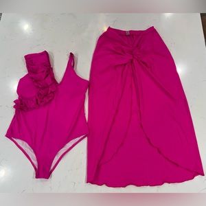 Pink one piece swimsuit with matching cover skirt